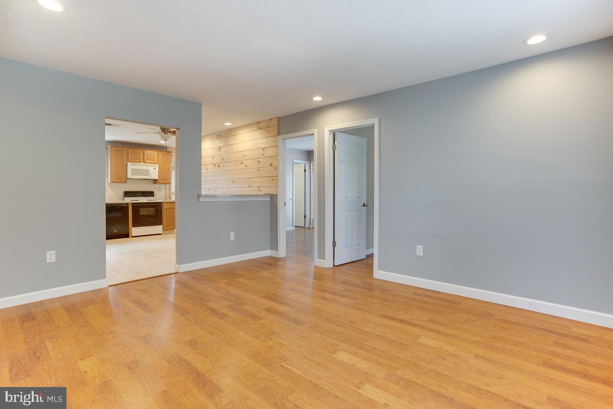 622 Old Love Point Road Stevensville, MD 21666 - Photo 6 of 38 Living Room with opening to Kitchen