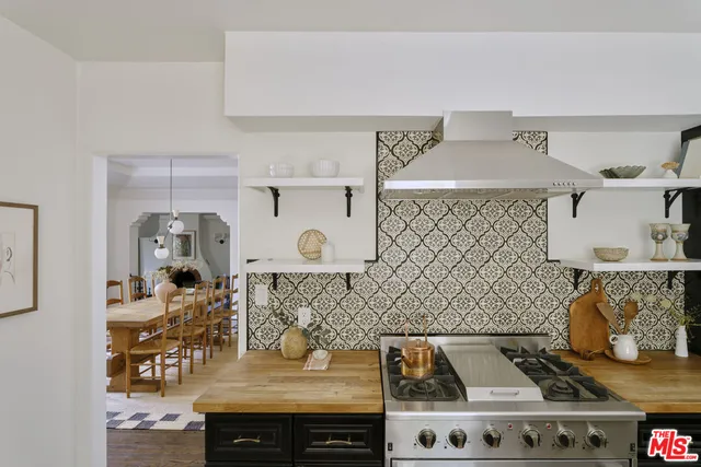 a view of a dining room with furniture and window