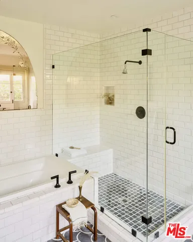 a bedroom with bed and window