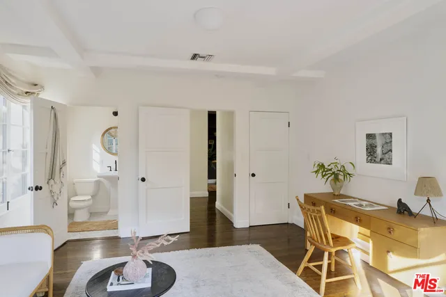 a bedroom with furniture and a table