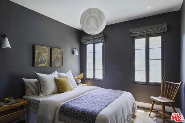 a view of a dining room with furniture and a chandelier