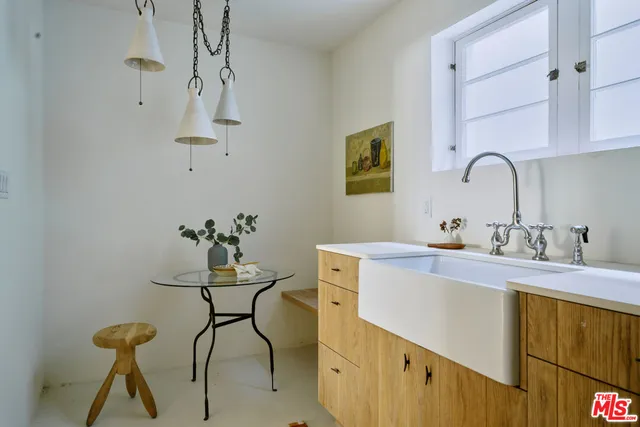 a view of outdoor sitting space and garden