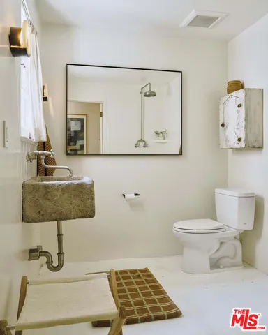 a view of a chairs and table in a patio