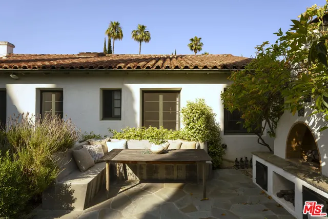 a pathway of a house with a yard