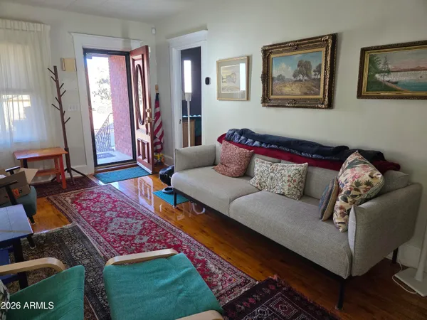 a living room with furniture and a rug