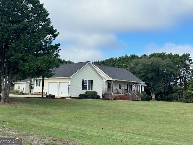 30 Vandeford Road Royston, GA 30662 - Photo 1 of 1 a front view of house with yard space and trees in the background