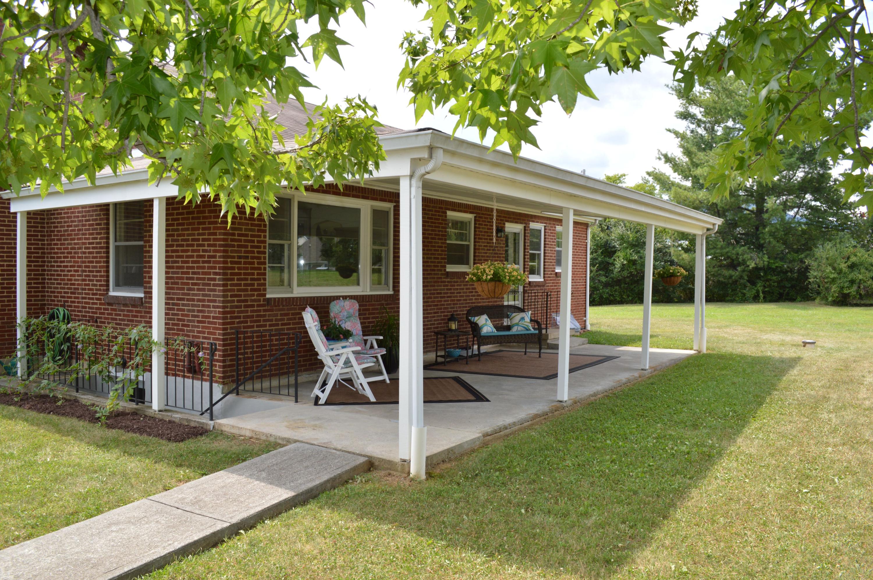 5527 Cove Road Roanoke, VA 24019 - Photo 15 of 39 a view of a house with backyard porch and sitting area