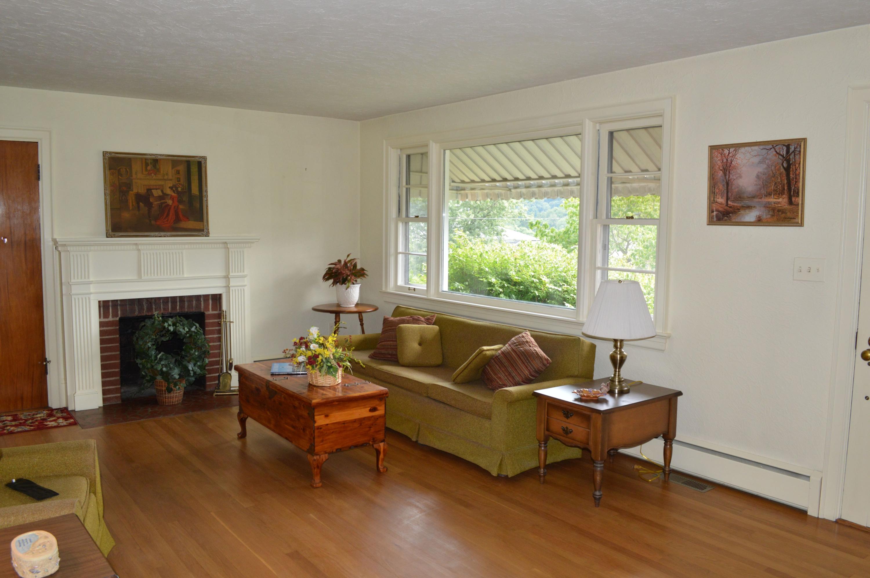 5527 Cove Road Roanoke, VA 24019 - Photo 19 of 39 a living room with furniture and a fireplace