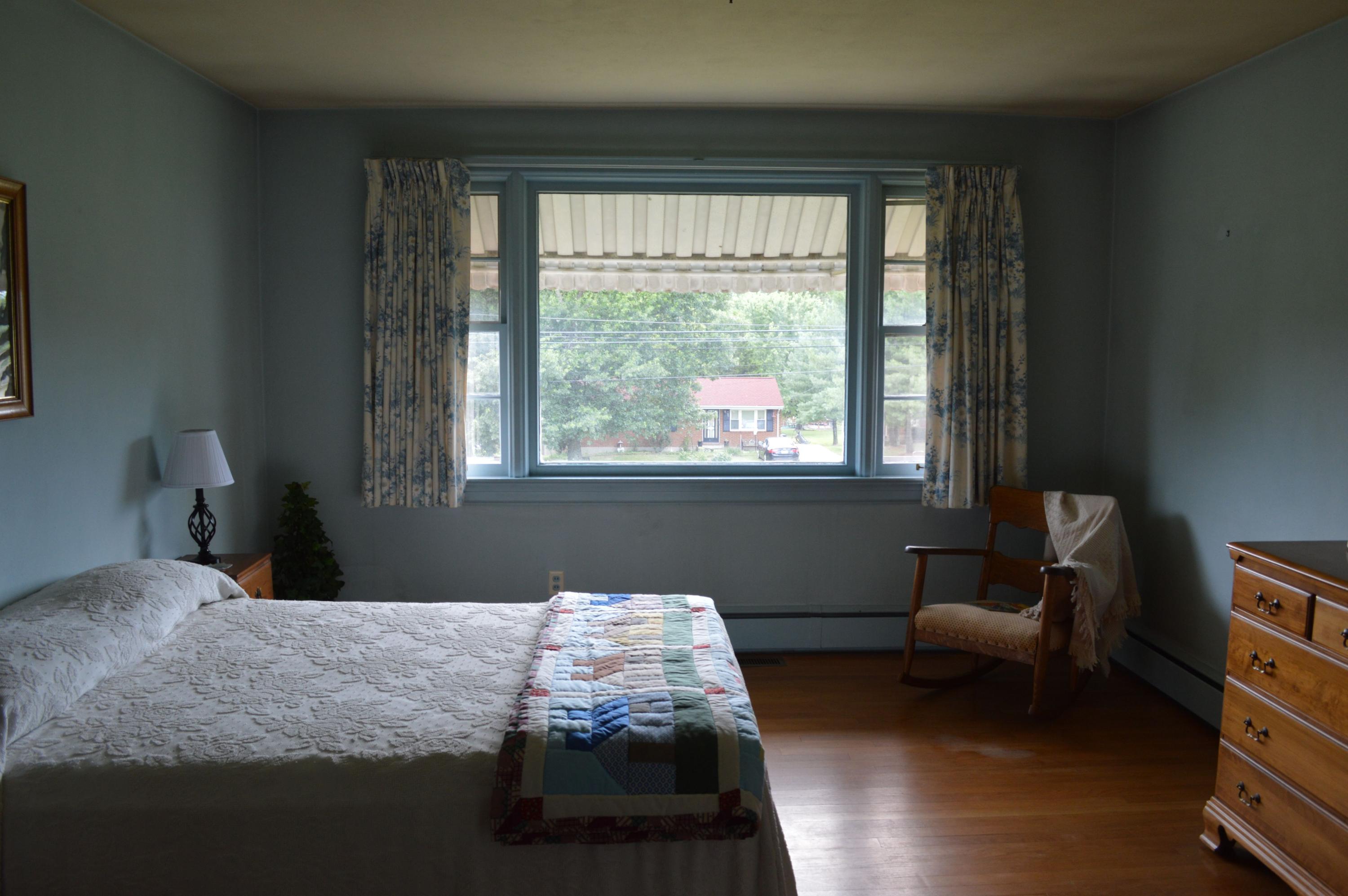 5527 Cove Road Roanoke, VA 24019 - Photo 32 of 39 a bedroom with a bed and a window