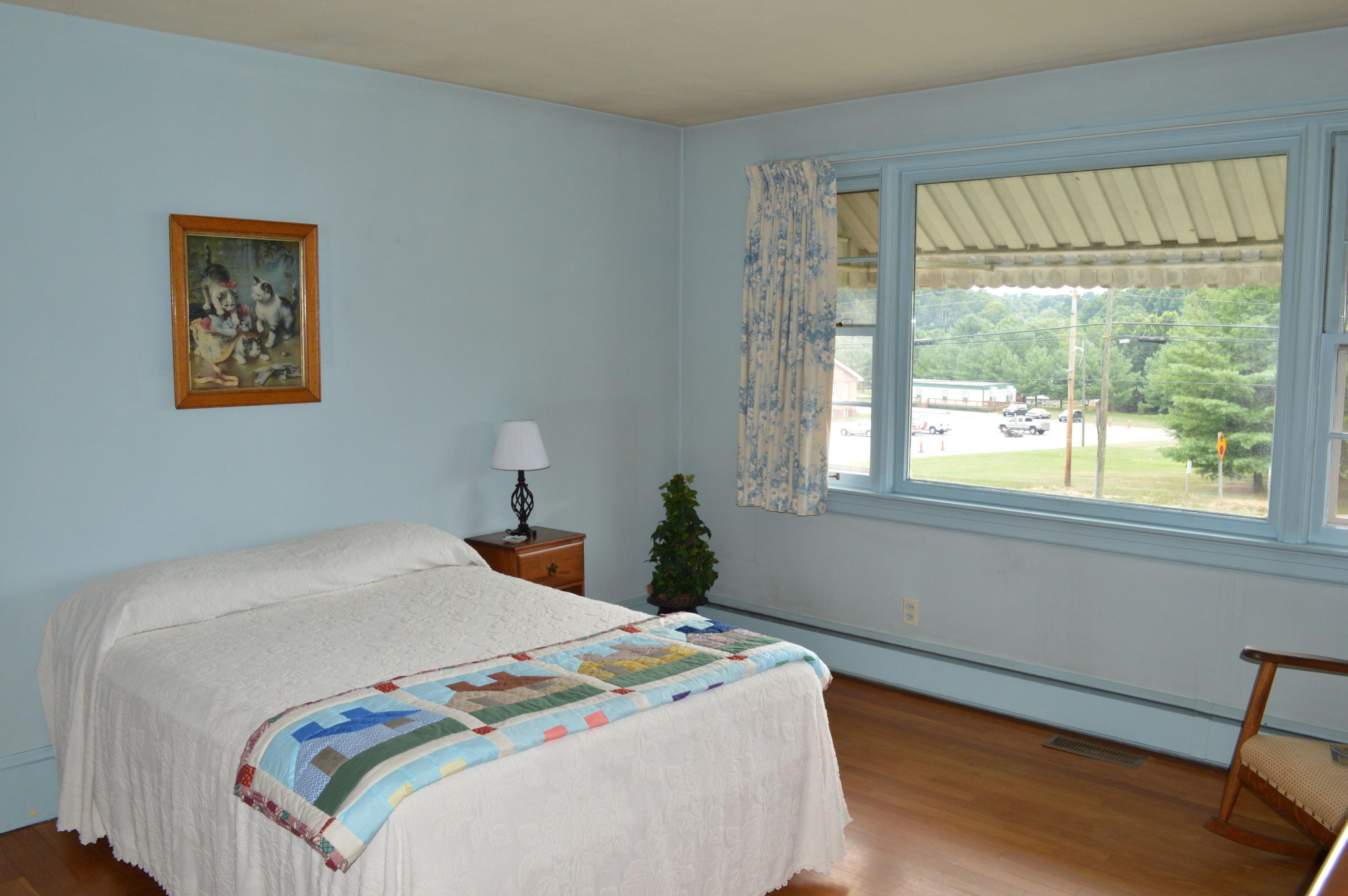 5527 Cove Road Roanoke, VA 24019 - Photo 33 of 39 a bedroom with a bed and a window