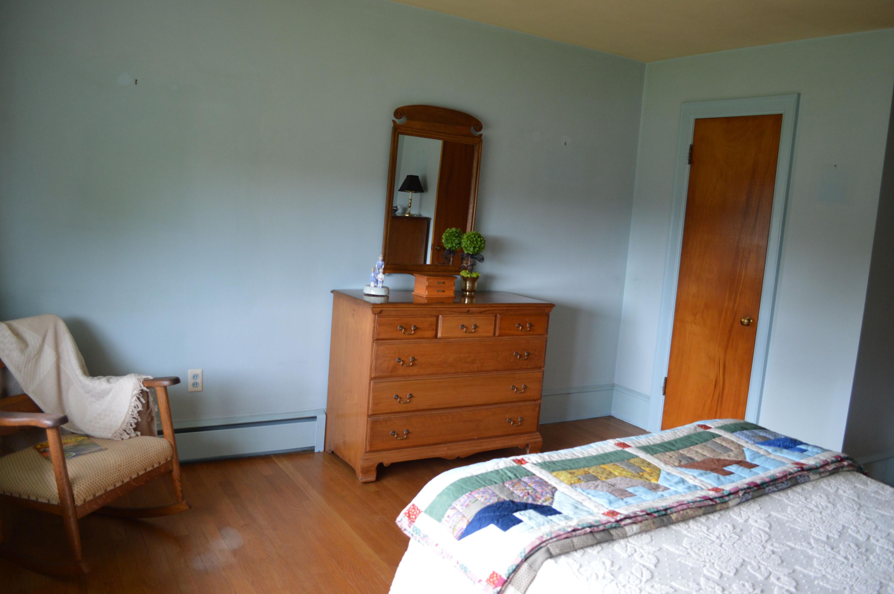 5527 Cove Road Roanoke, VA 24019 - Photo 34 of 39 a bedroom with a bed and chair