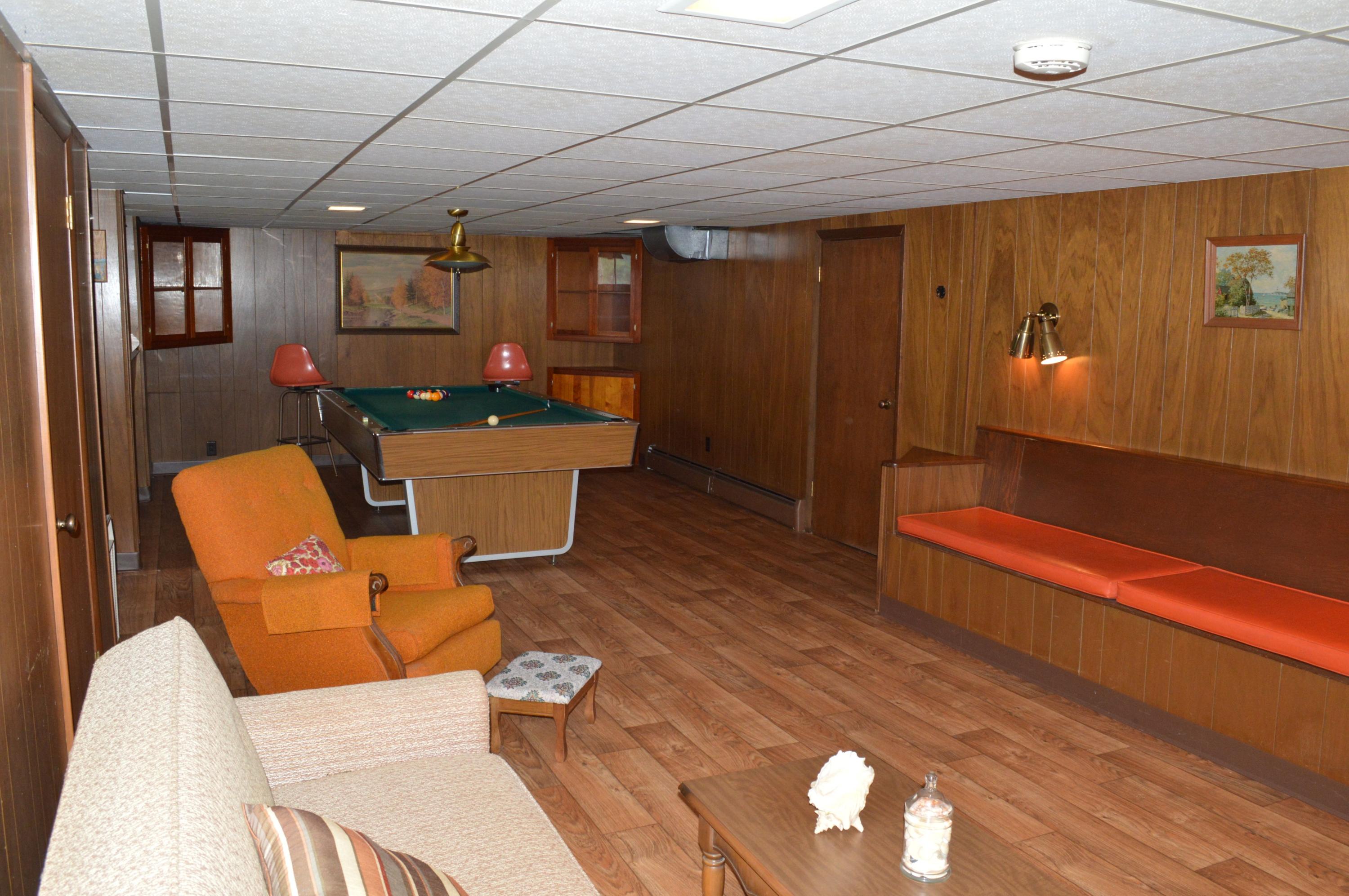 5527 Cove Road Roanoke, VA 24019 - Photo 38 of 39 a view of a dining room with furniture a chandelier and wooden floor