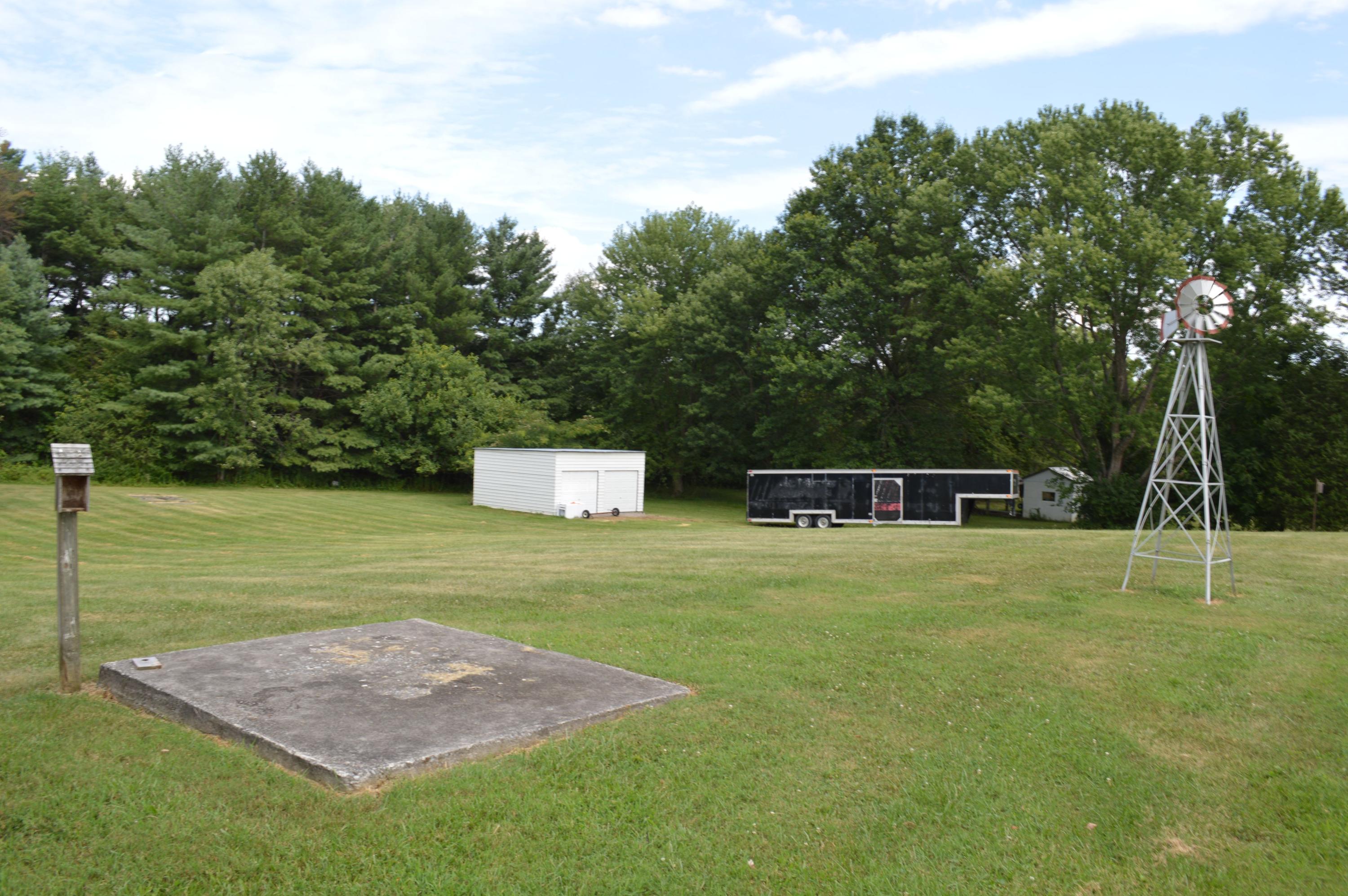 5527 Cove Road Roanoke, VA 24019 - Photo 9 of 39 a big yard with some trees in the background