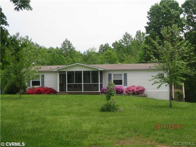 1222 Bible Road Crewe, VA 23930 - Photo 2 of 12 a view of a house with a yard and potted plants