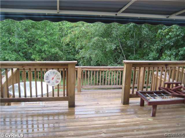 1222 Bible Road Crewe, VA 23930 - Photo 3 of 12 a view of a deck with wooden floor and fence