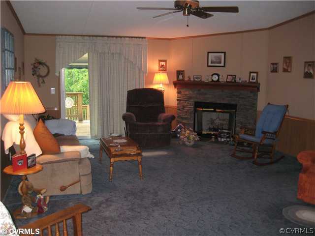 1222 Bible Road Crewe, VA 23930 - Photo 4 of 12 a living room with furniture a window and a fireplace