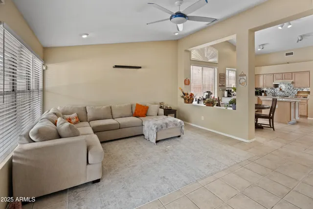 a living room with furniture and white walls
