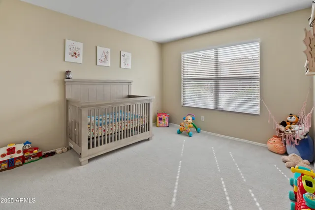 a bedroom with furniture and a window