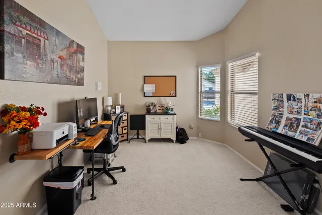 a workspace with furniture and a window