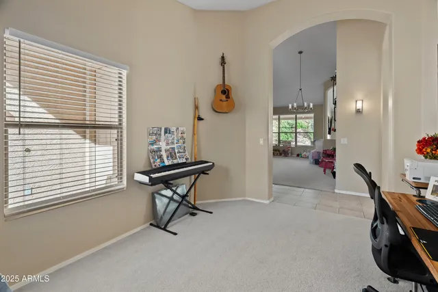 a view of a livingroom with furniture and a window