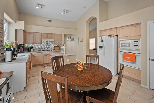 a dining room with furniture and window