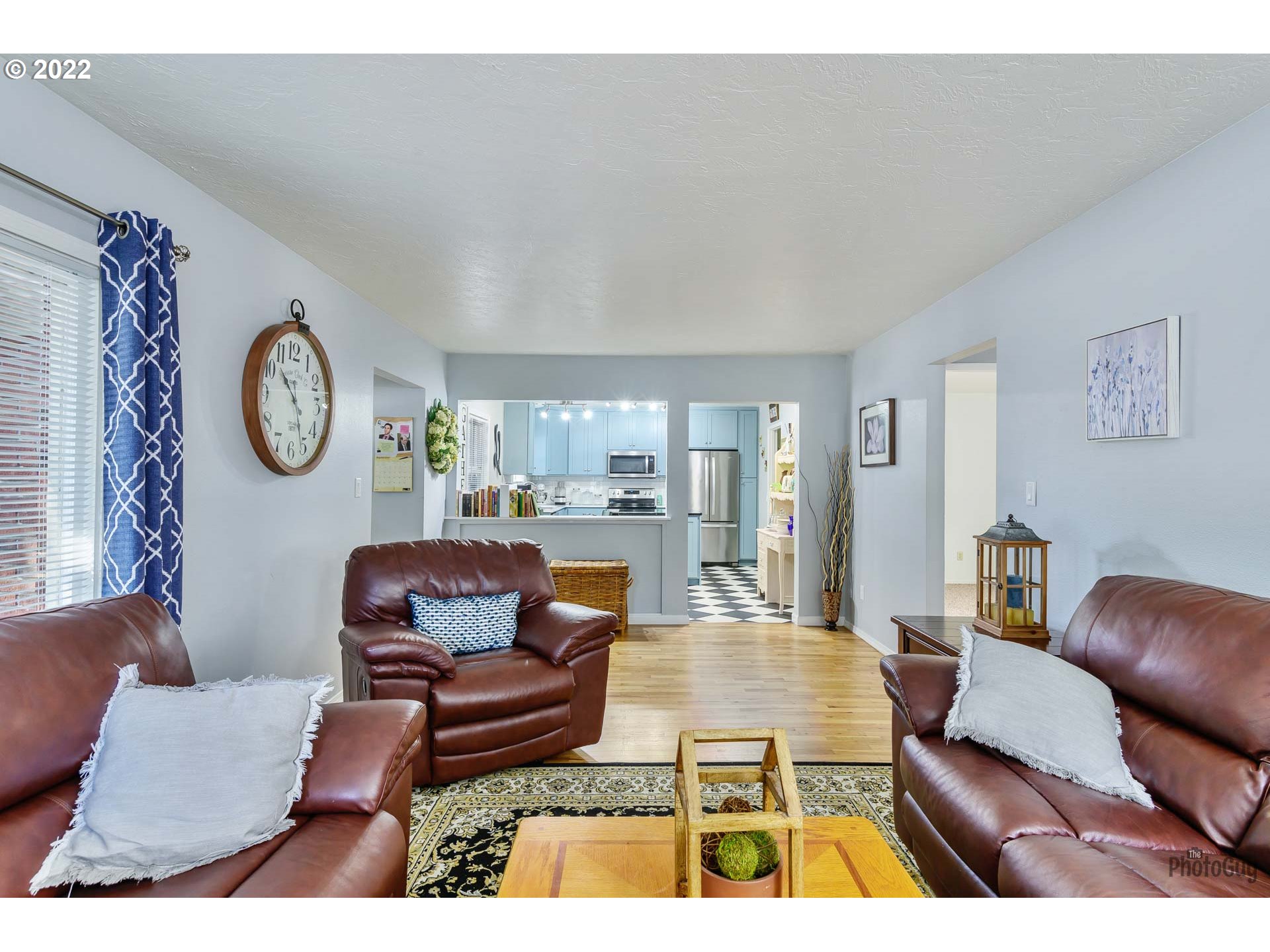 3268 Oregon Avenue Springfield, OR 97478 - Photo 5 of 32 a living room with furniture a clock on wall and a window