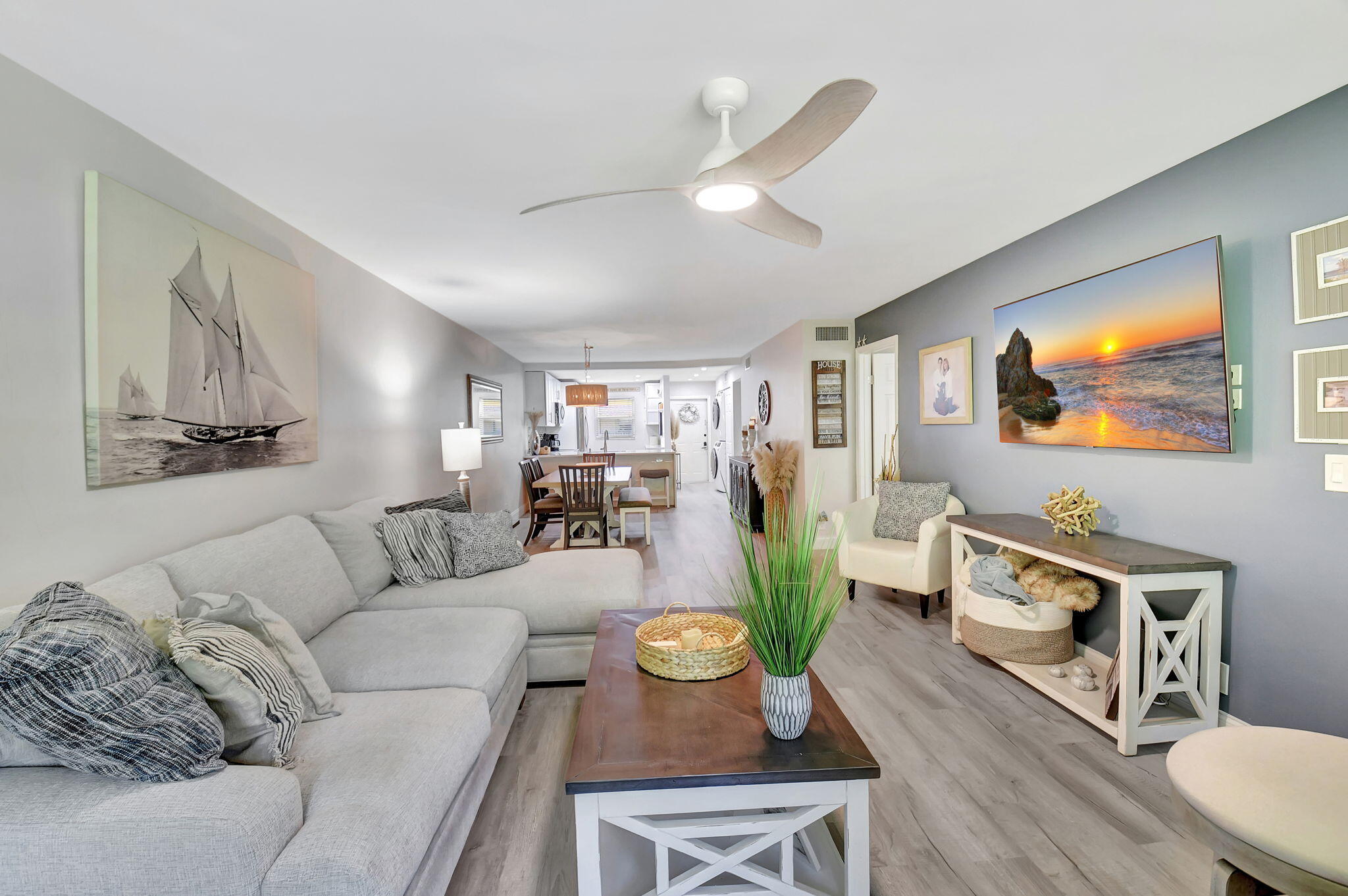 2805 Southwest 22nd Avenue, Unit 2050 Delray Beach, FL 33445 - Photo 14 of 36 a living room with furniture and a flat screen tv