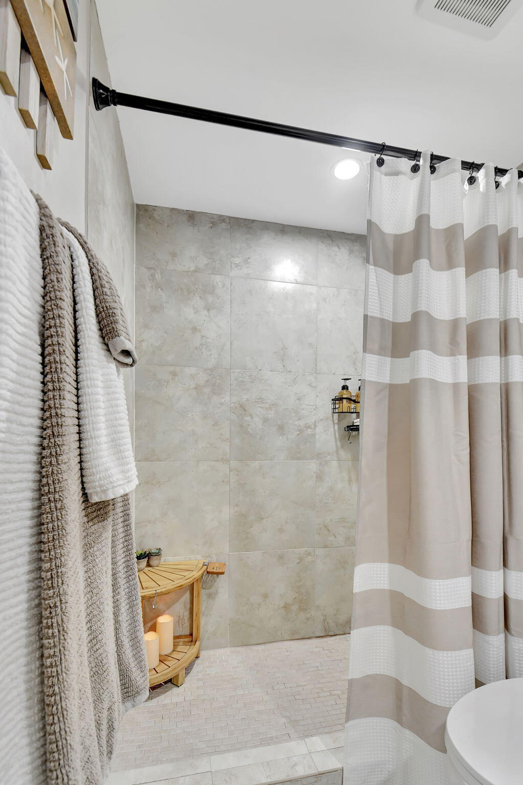 2805 Southwest 22nd Avenue, Unit 2050 Delray Beach, FL 33445 - Photo 22 of 36 a bathroom with a shower curtain and a shower