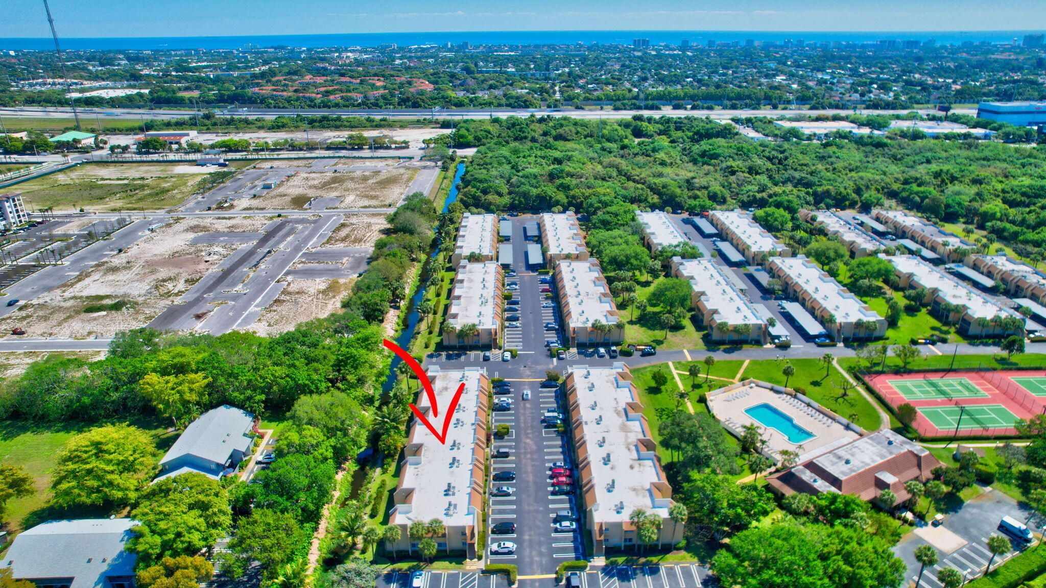 2805 Southwest 22nd Avenue, Unit 2050 Delray Beach, FL 33445 - Photo 26 of 36 an aerial view of residential houses with outdoor space and trees