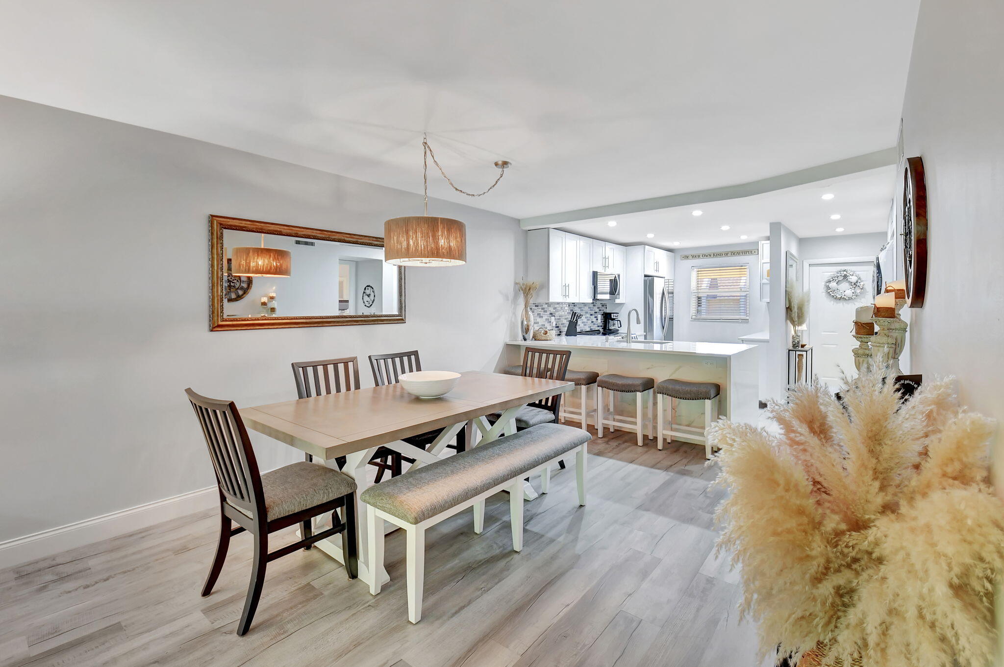 2805 Southwest 22nd Avenue, Unit 2050 Delray Beach, FL 33445 - Photo 8 of 36 a living room with furniture and a wooden floor