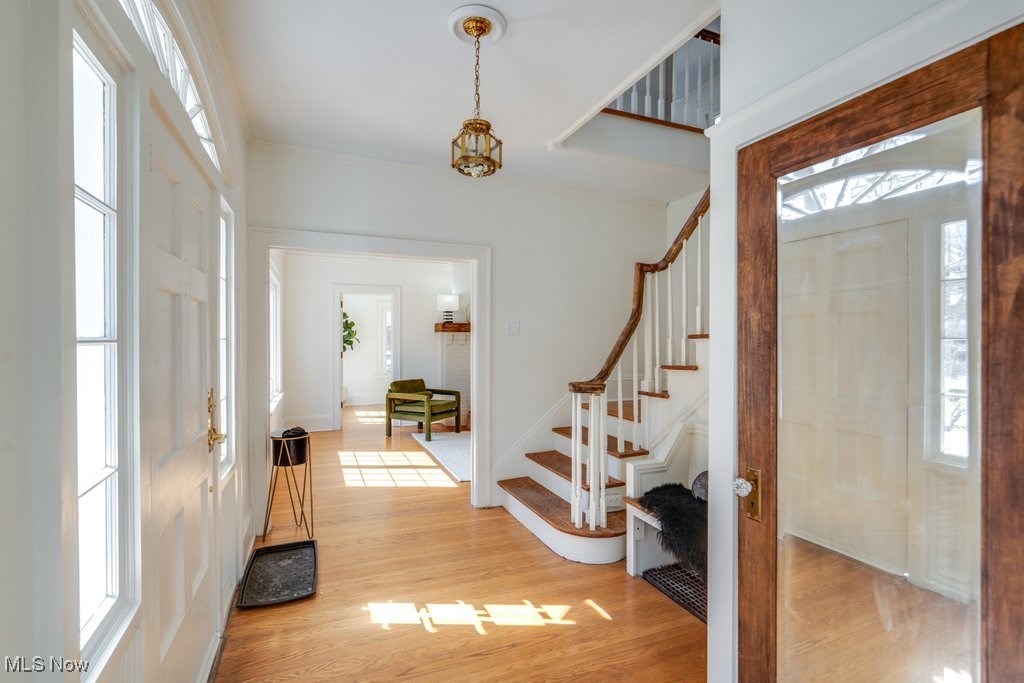 199 Edgerton Road Akron, OH 44303 - Photo 4 of 49 Entryway with stairs, light wood-style floors, and baseboards
