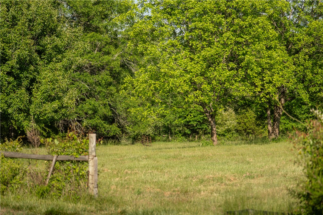 1610 Cannon Bottom Road, Unit LOT 2 Belton, SC 29627 - Photo 10 of 10 Expansive green spaces and mature trees define this idyllic property, perfect for outdoor living.