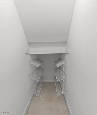 a view of wooden floor and windows in a room