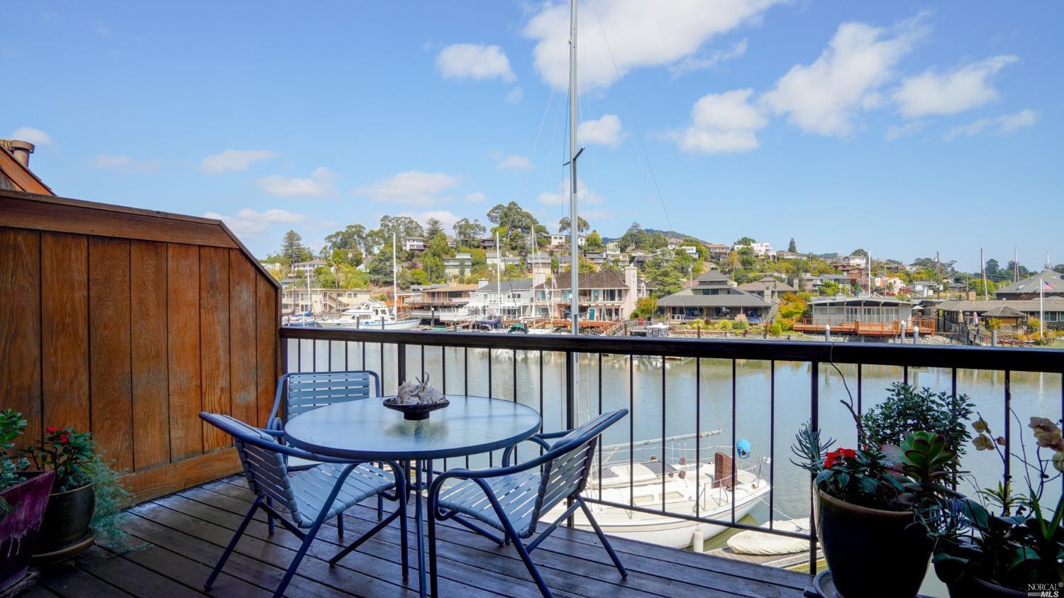 a view of a chairs and table in patio