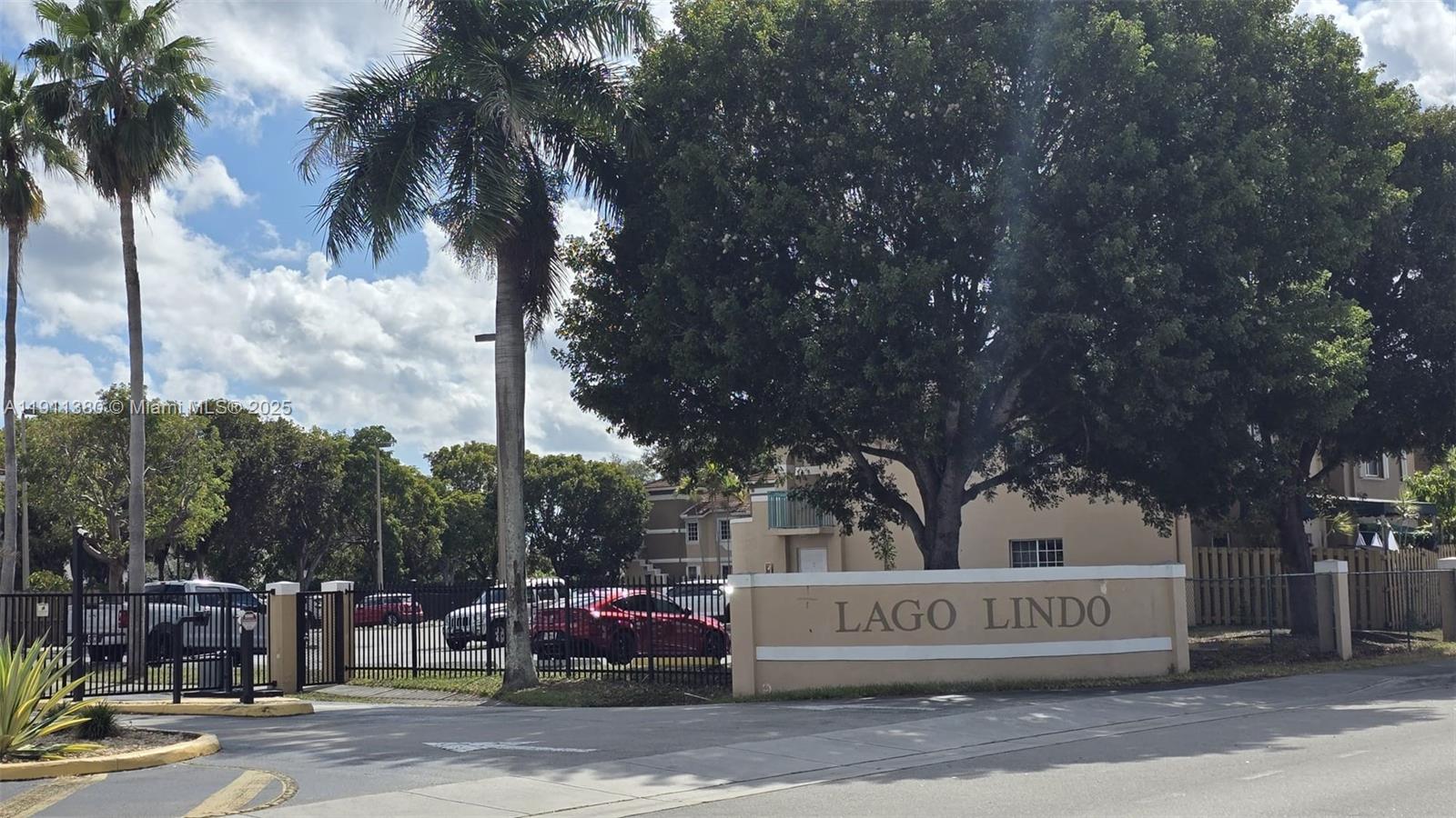 13120 Southwest 64th Terrace, Unit 1510 Miami, FL 33183 - Photo 2 of 24 a front view of a building with trees