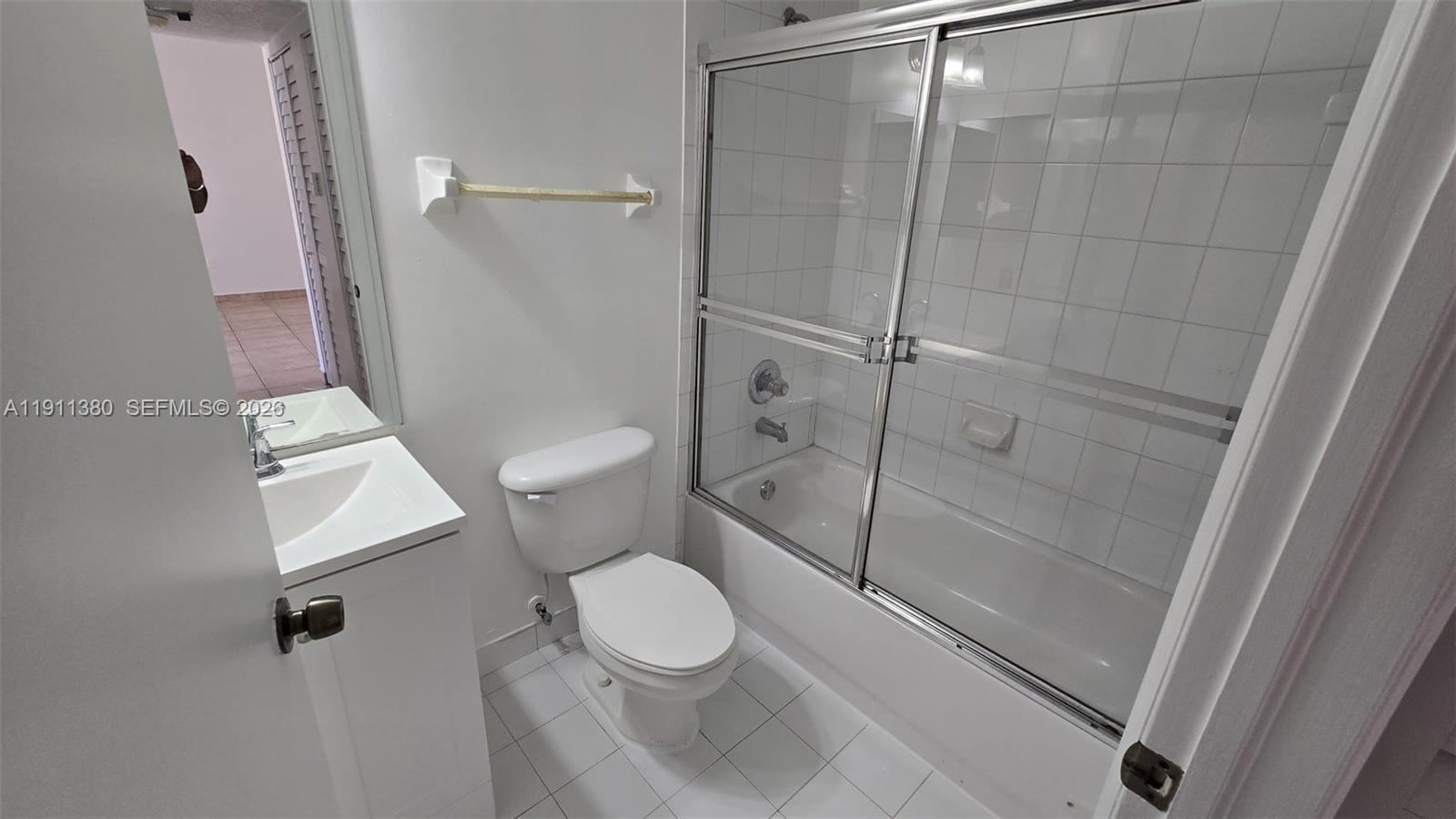 13120 Southwest 64th Terrace, Unit 1510 Miami, FL 33183 - Photo 22 of 25 a bathroom with a toilet and a shower