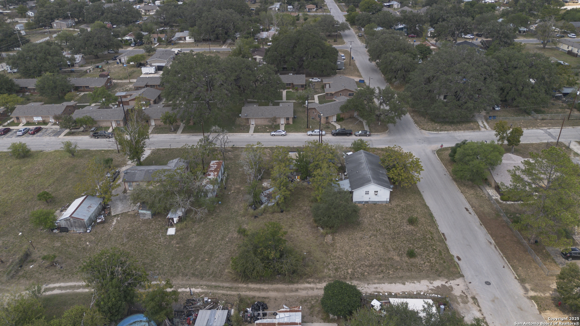 732 Trade Street Pleasanton, TX 78064 - Photo 11 of 13 an aerial view of residential houses with outdoor space