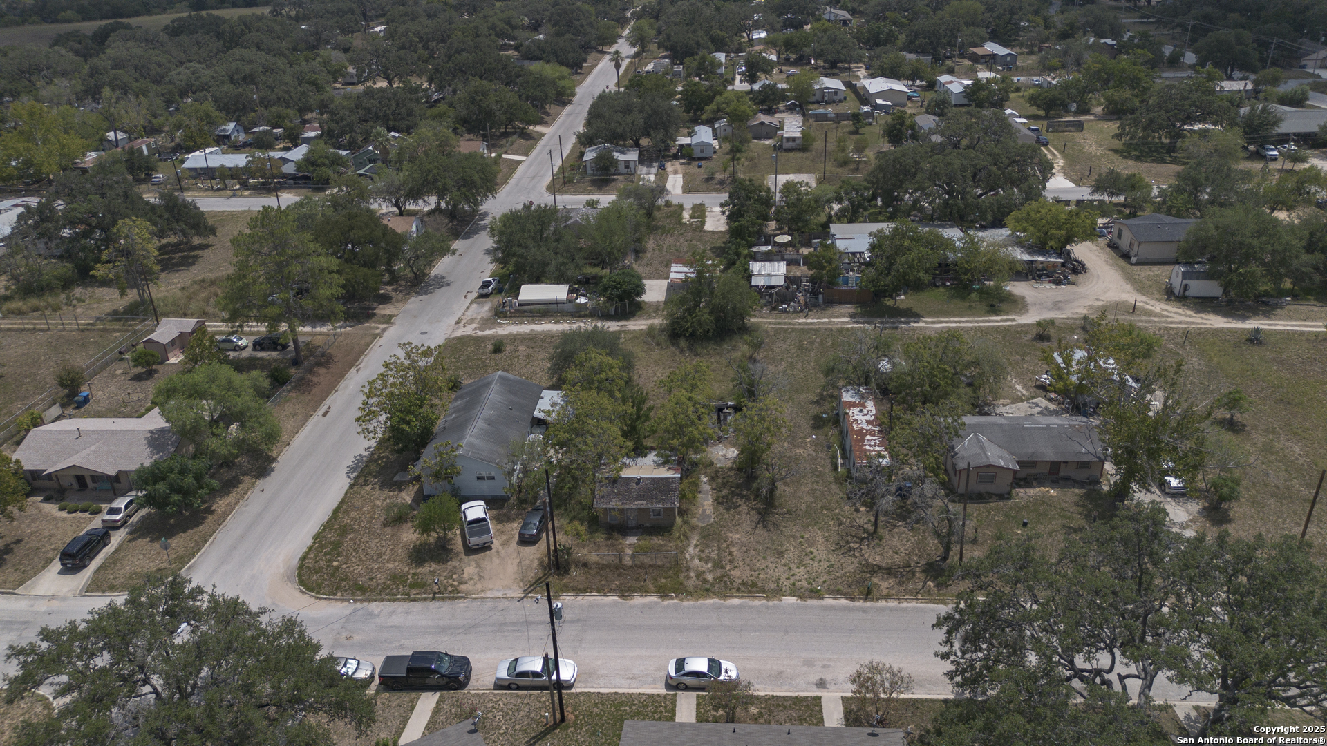 732 Trade Street Pleasanton, TX 78064 - Photo 13 of 13 an aerial view of residential houses with outdoor space and trees