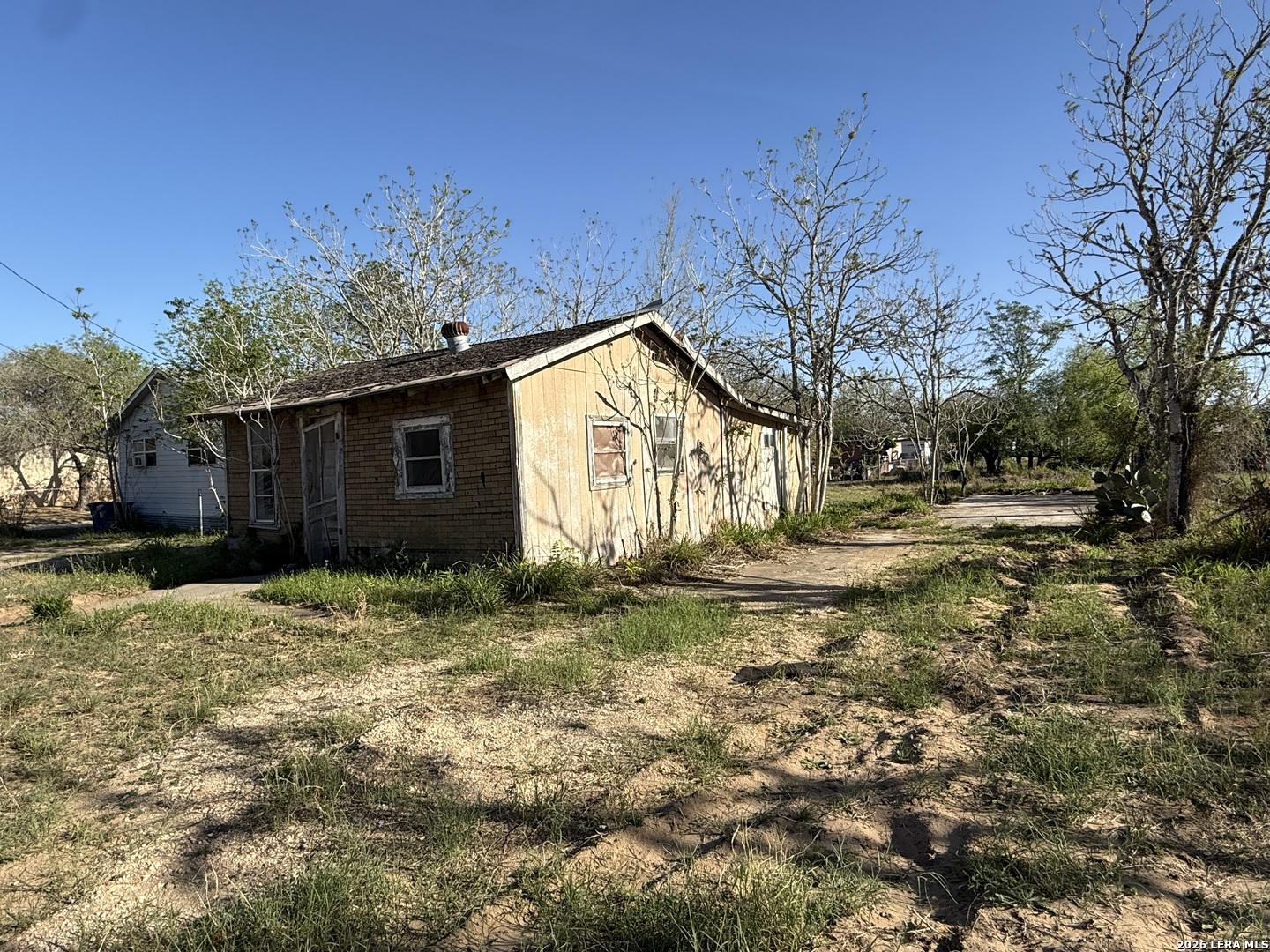 732 Trade Street Pleasanton, TX 78064 - Photo 2 of 13 a view of a house with a yard