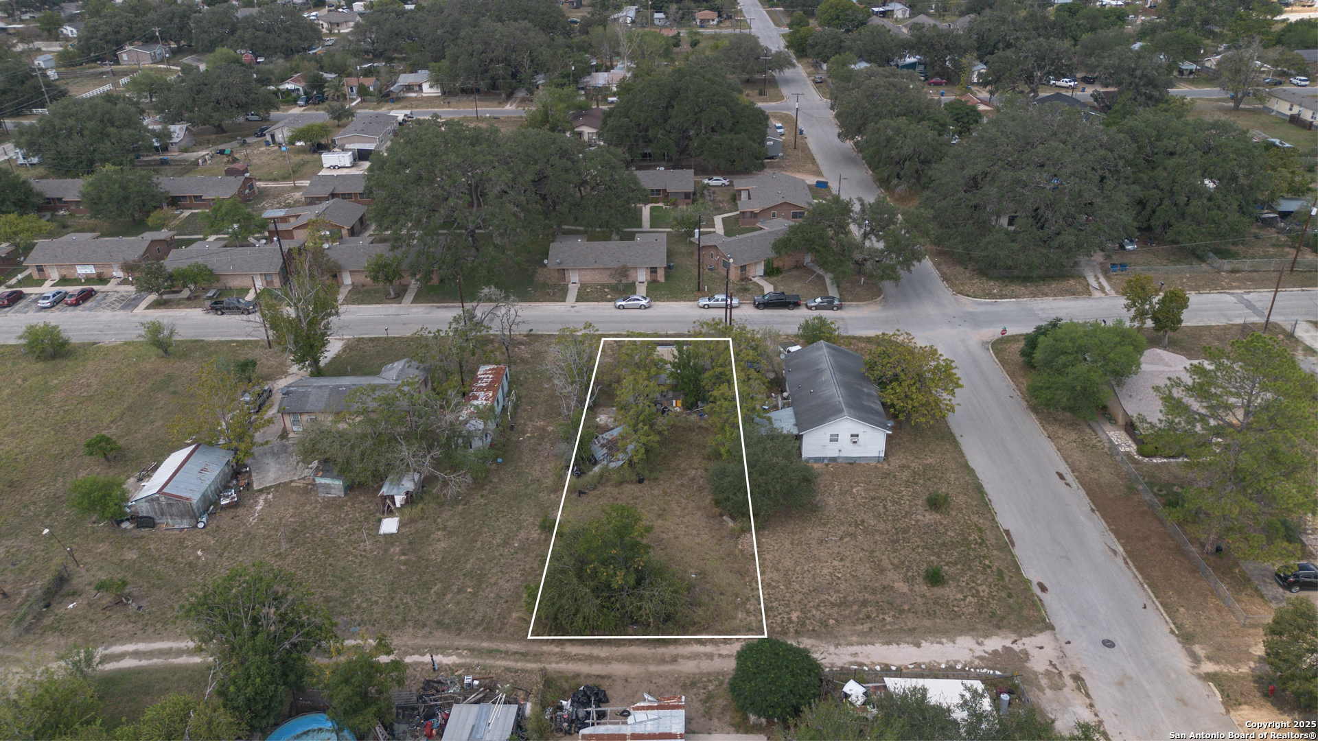 732 Trade Street Pleasanton, TX 78064 - Photo 7 of 13 an aerial view of residential houses with outdoor space