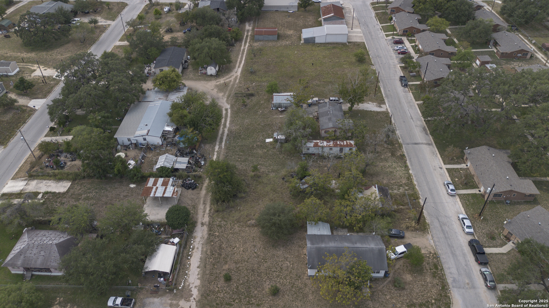 732 Trade Street Pleasanton, TX 78064 - Photo 8 of 13 an aerial view of residential houses with outdoor space