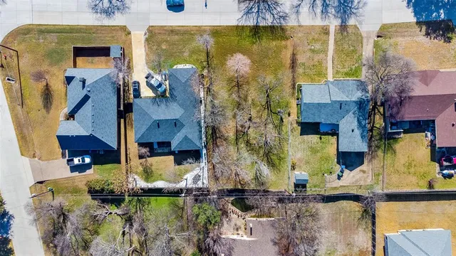 aerial view of a house with a yard
