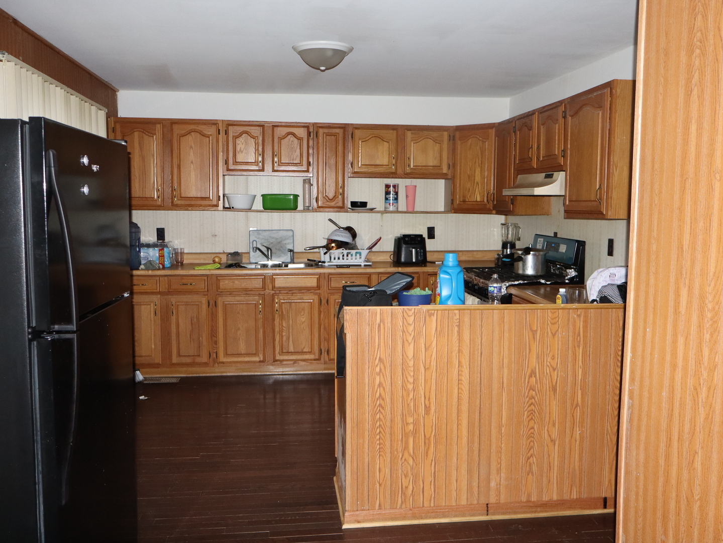 1404 South Monroe Street Streator, IL 61364 - Photo 6 of 9 a kitchen with stainless steel appliances granite countertop a refrigerator sink and cabinets