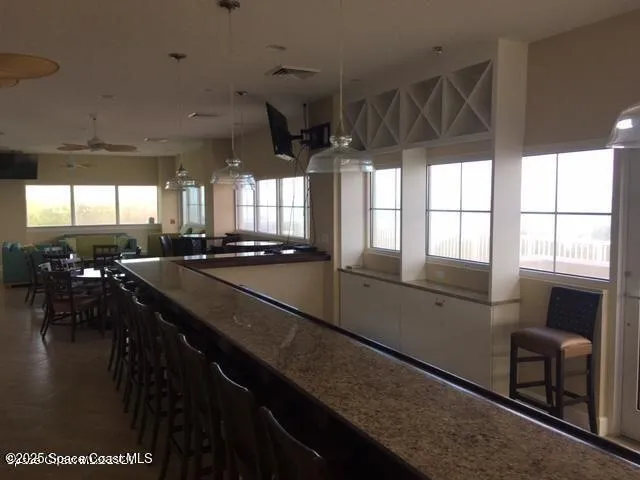 a kitchen with counter top space a sink and appliances