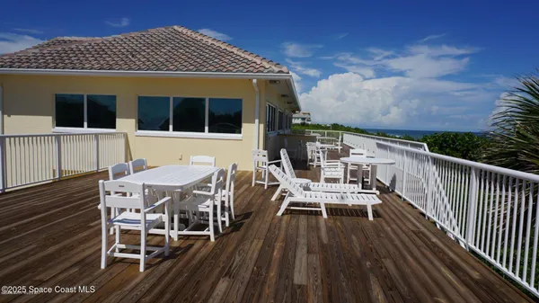 a view of a chairs and table on the deck