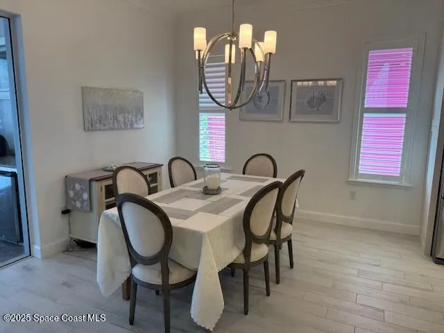 a view of a dining room with furniture and a mirror