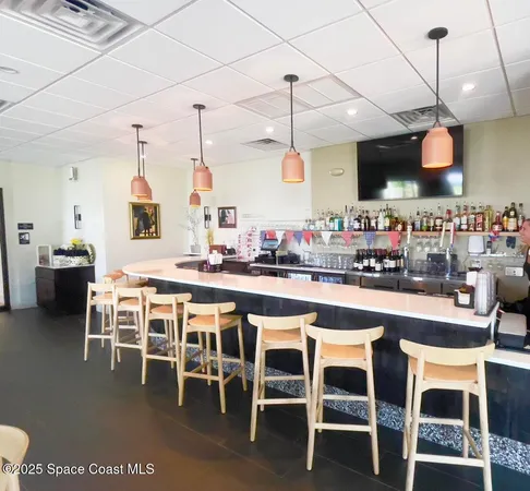 a large kitchen with a table and chairs