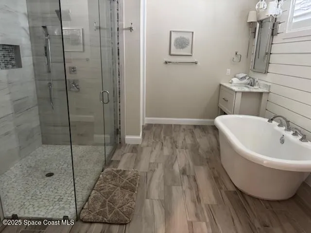 a bathroom with a bathtub and shower