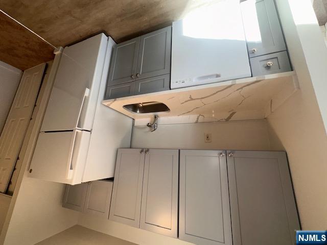 873 Main Street, Unit 2E Hackensack, NJ 07601 - Photo 6 of 23 a utility room with dryer and washer