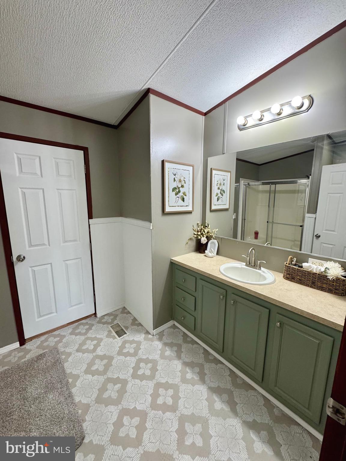 73 Mill Gap Road Brandywine, WV 26802 - Photo 20 of 35 a spacious bathroom with a mirror sink and a toilet